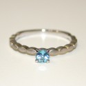 WHITE GOLD BREUNING RING WITH BLUE TOPAZ